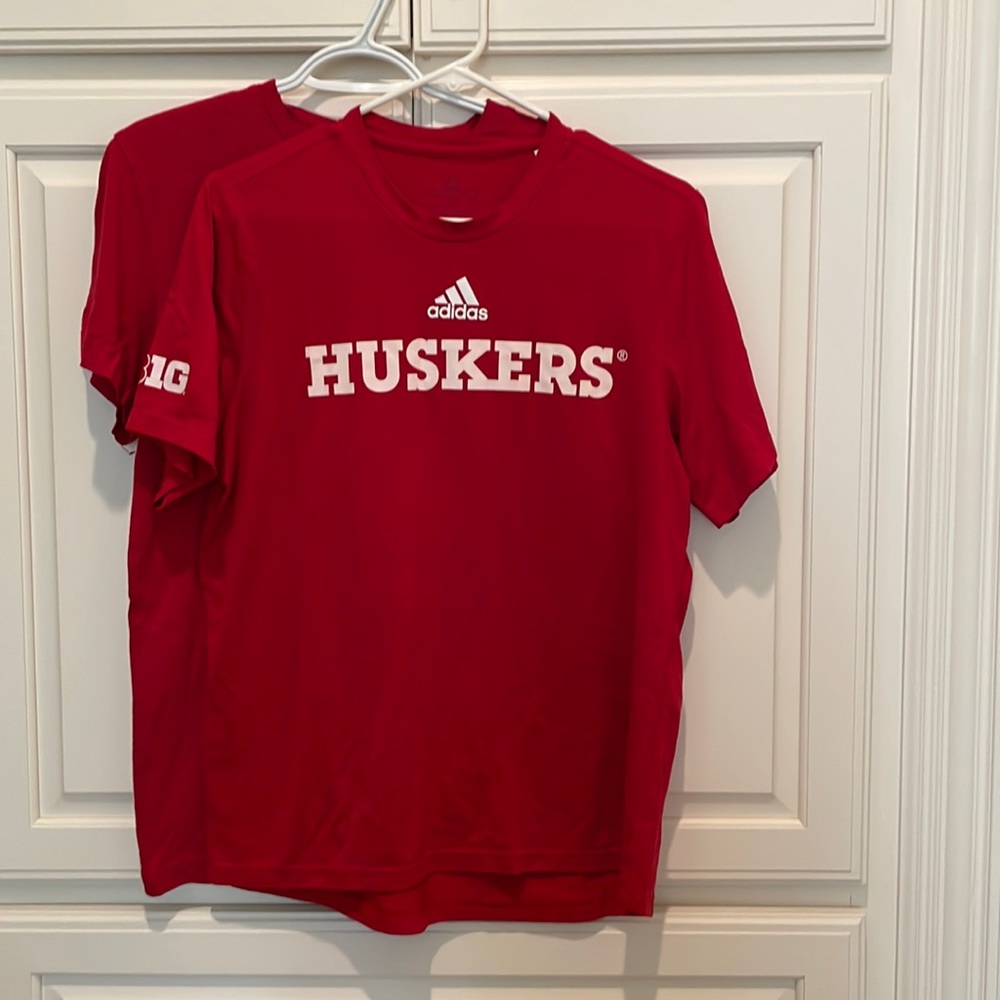 Nebraska University short sleeve shirts.